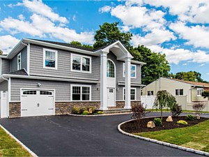 asphalt blacktop circle driveway circular brick border cultured stone house faststak nicolock westchester bluestone stoop